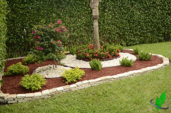 After - Can you see the harmony between the color of the rock's edging and the White River Rock in the Flower Bed?